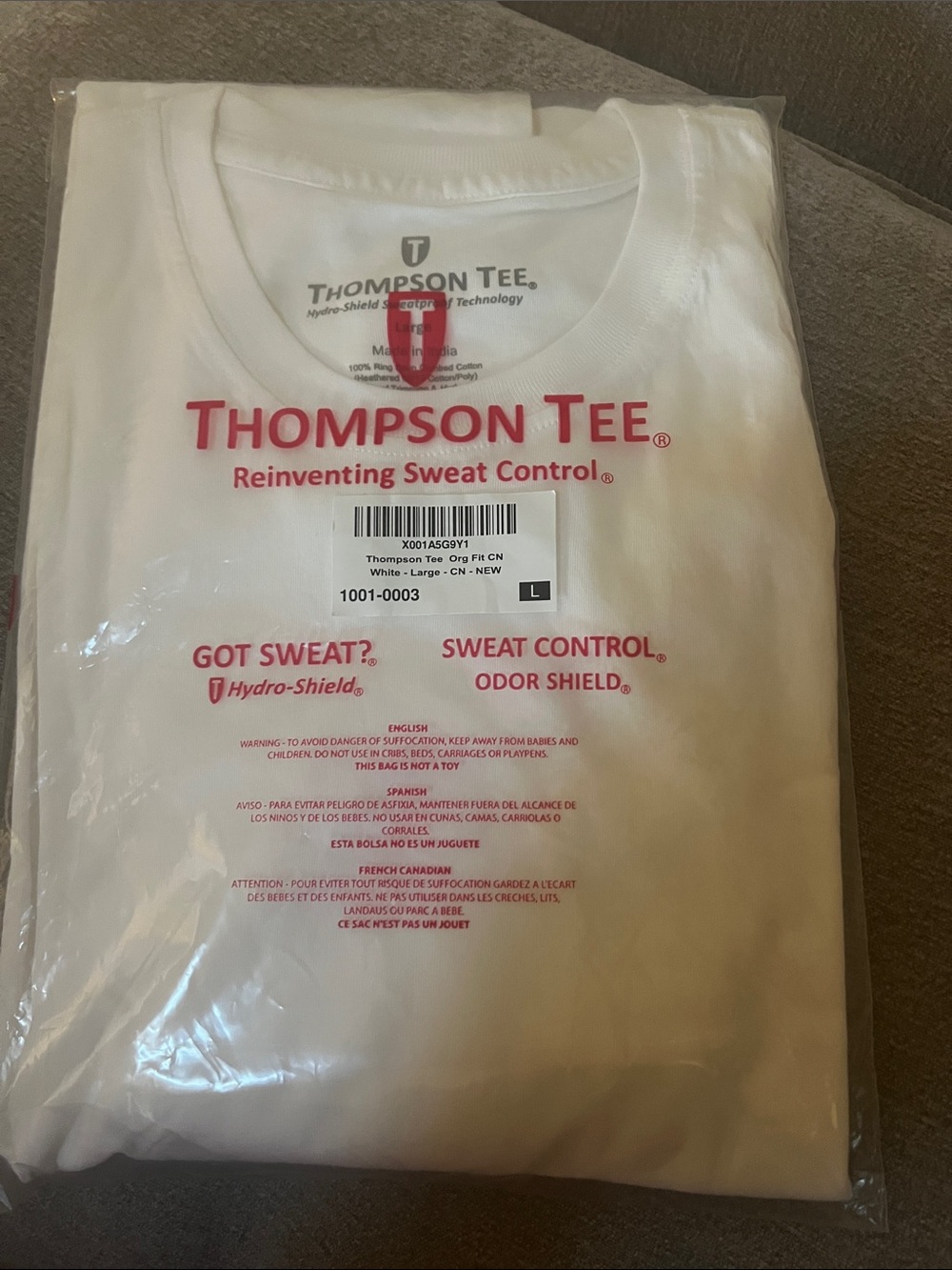 Thompson Tee White Short Sleeve Shirt with Red Logo Text